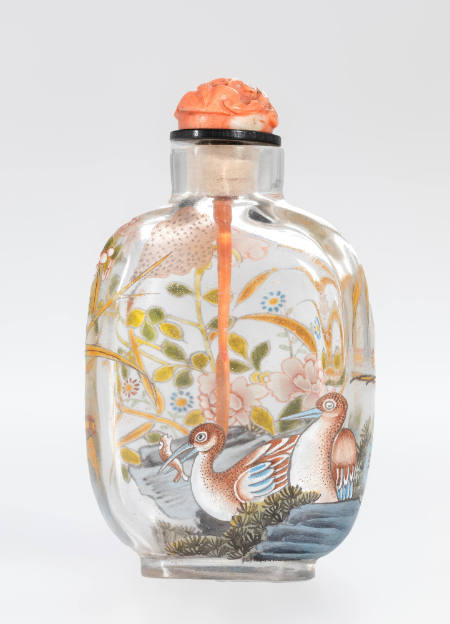 Snuff bottle with geese depicted on one side, and a flowering marsh on the other