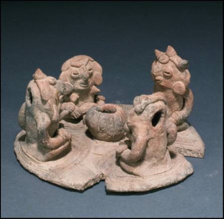 Modeled clay scene of four figures seated around lime pot