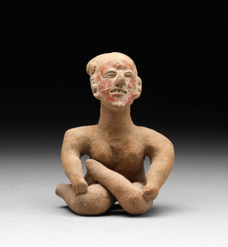 Seated female figurine
