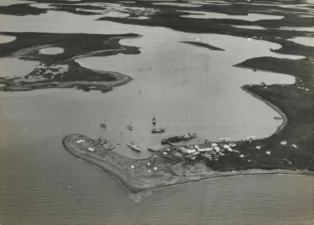 [Aerial view of the mainland meeting the Arctic Ocean]