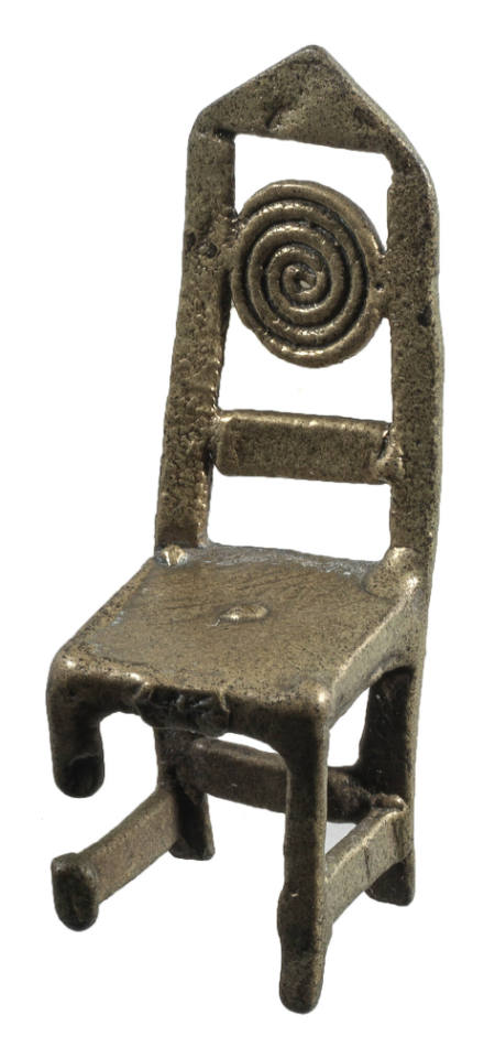 Goldweight in the form of a chair having a coil motif on its back and a triangular top