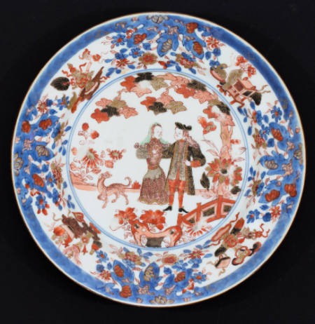 Plate with design of a Dutch couple in a garden