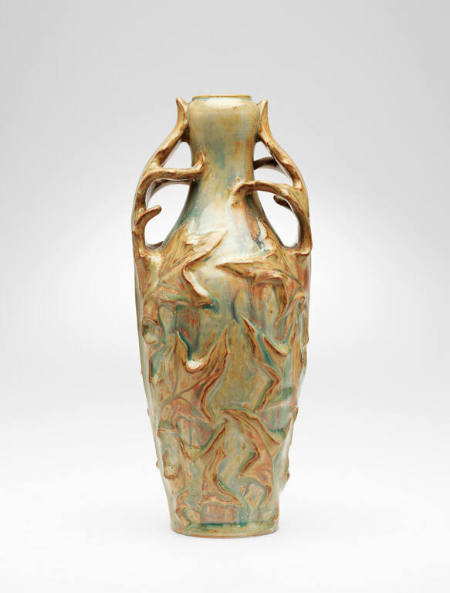 Unique vase with applied thistle-leaf design