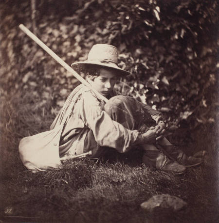 [Seated young man with staff and satchel]