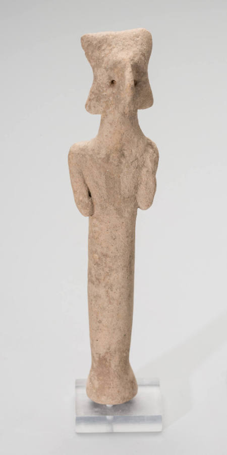 Figurine with geometric headdress