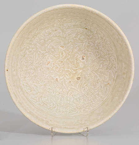 Bowl with a molded decoration of birds and floral scrolls