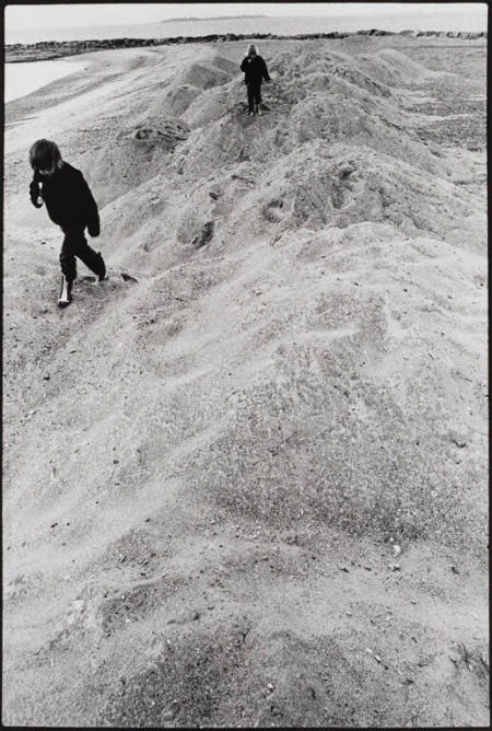 Children on sand piles, Westport, Connecticut