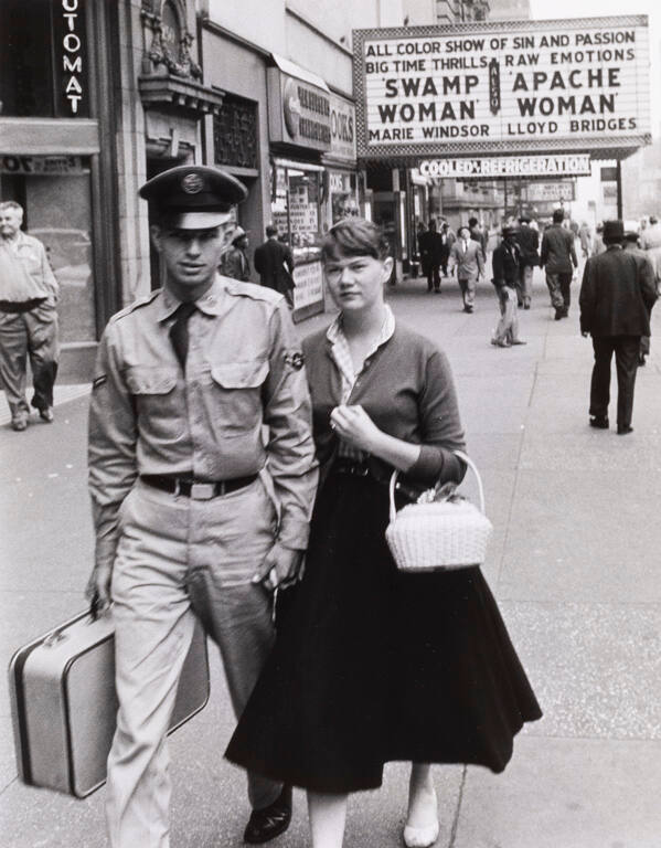 Couple in front of movie theater, New York City