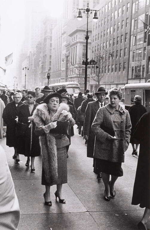 Woman in fur coat on 49th Street, New York City