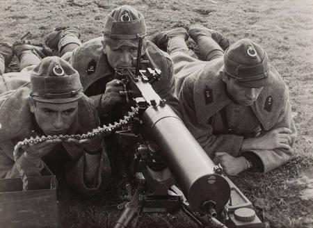 [Turkish soldier manning machine gun during training maneuvers]