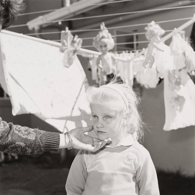 Blind girl with dolls, South Africa