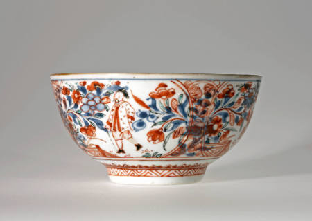 "Clobbered Dutch" bowl with design of birds, flowers, and figures in a garden
