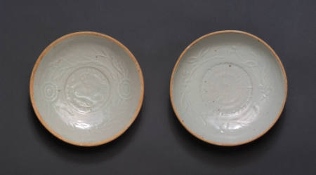 One of a pair of Qingbai bowls with molded designs
