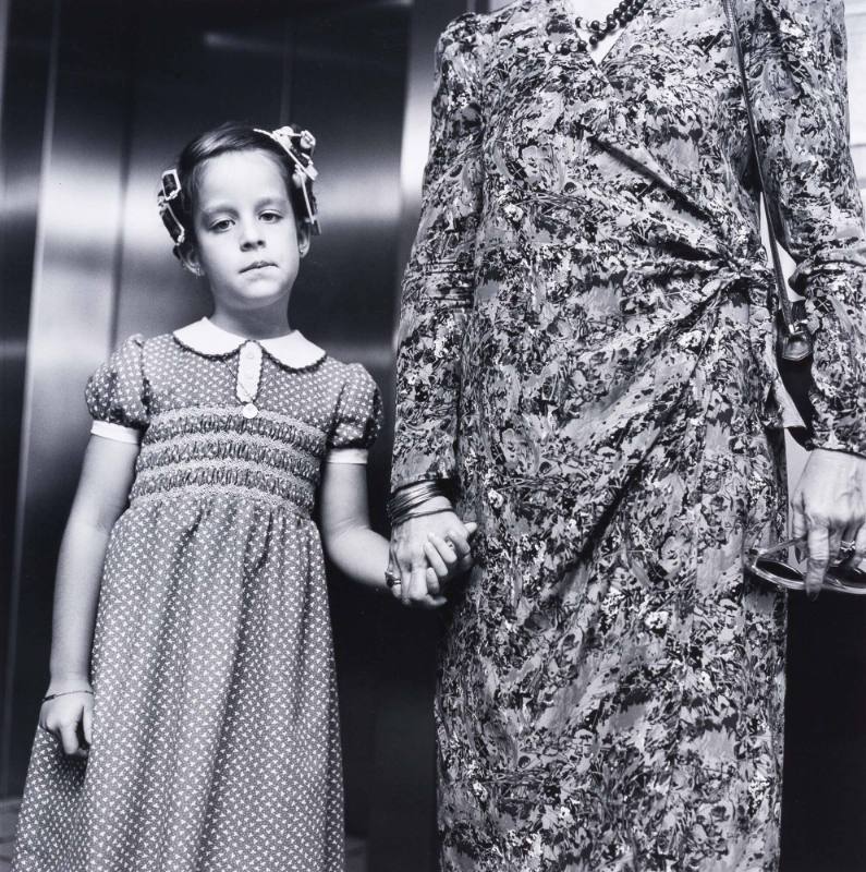 Girl with hair curlers and mother, Miami
