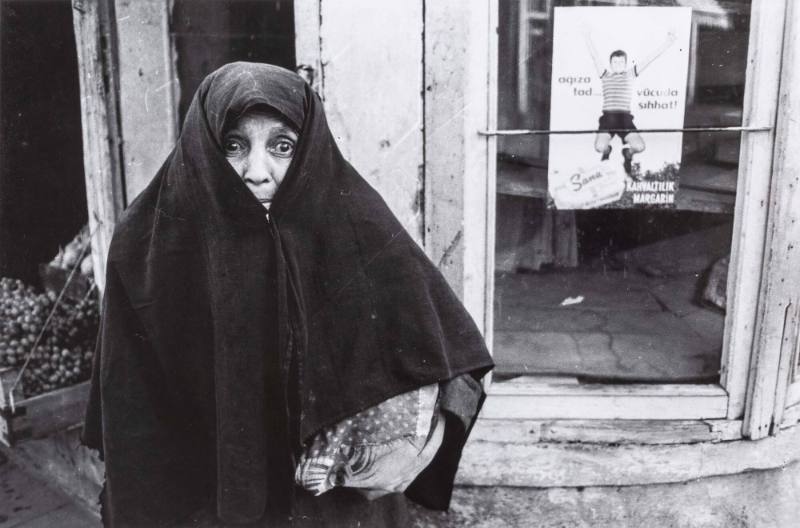 Frightened woman in cloak, Turkey