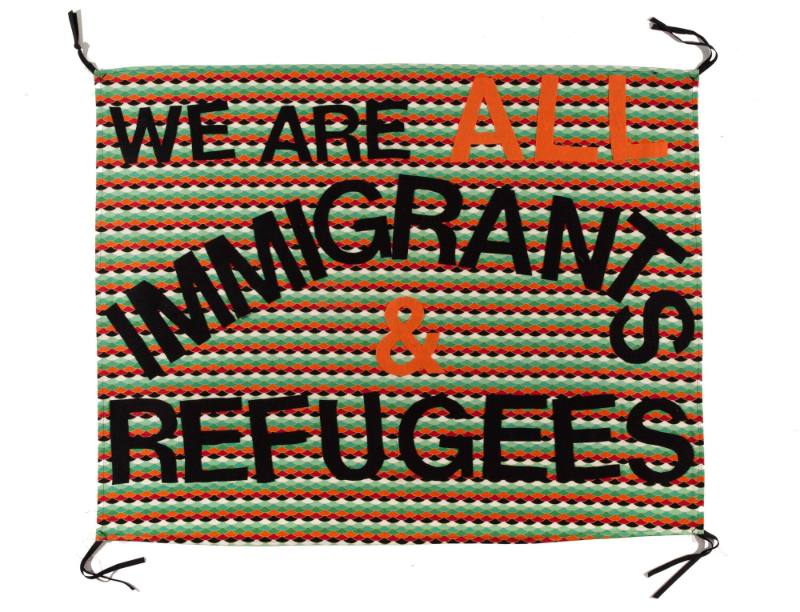 We are All Immigrants and Refugees, from the artist's Protest Banner Lending Library (2016–ongoing), created by an anonymous workshop participant during the Johnson Museum exhibition, how the light gets in (September 7–December 8, 2019)
