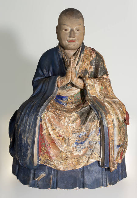Seated Buddhist priest