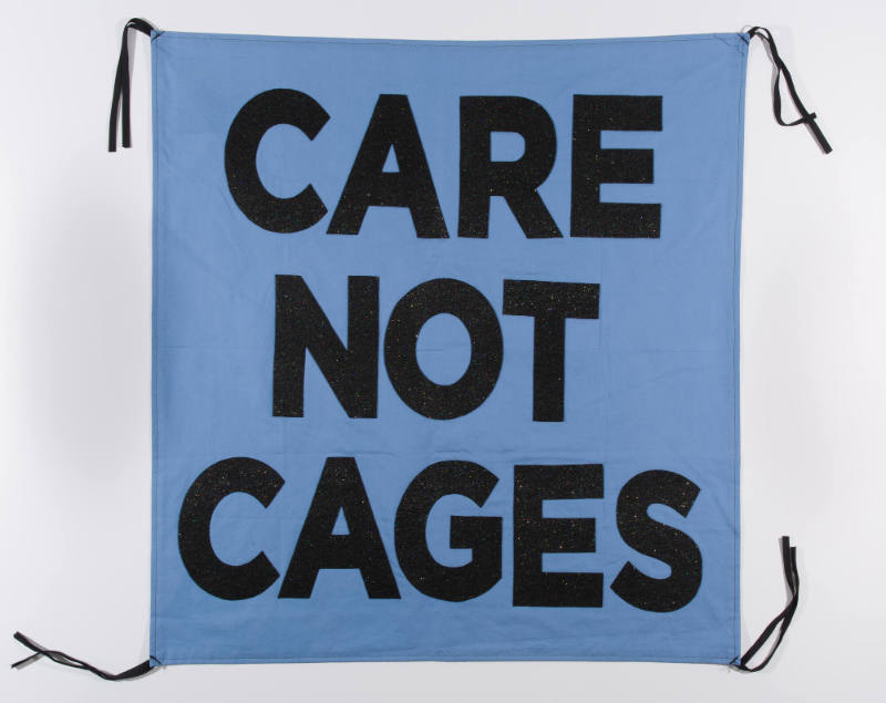Care, Not Cages, from the artist's Protest Banner Lending Library (2016–ongoing), created by an anonymous workshop participant during the Johnson Museum exhibition, how the light gets in (September 7–December 8, 2019)