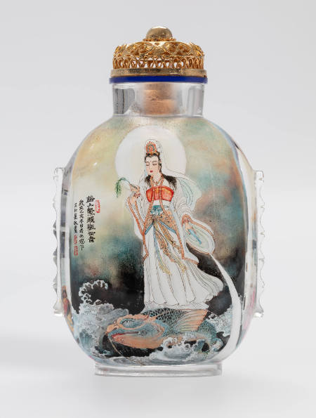 Snuff bottle with scene of Quan Yin riding on a giant carp