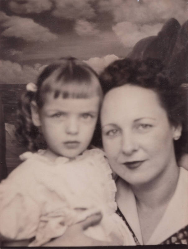 Photo booth portrait of a woman with a little girl