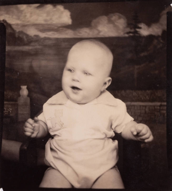 Photo booth portrait of chubby baby wearing a 