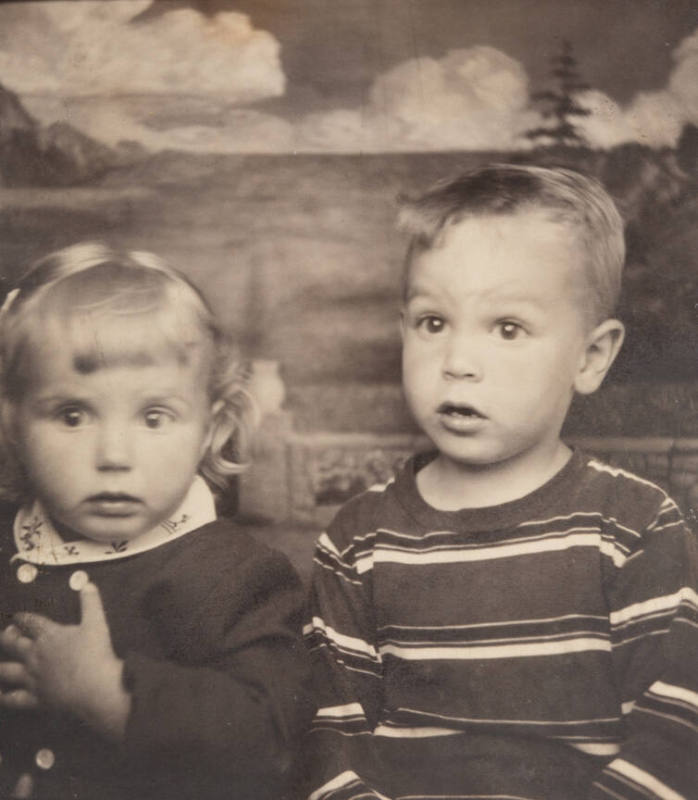 Photo booth portrait of a little boy and girl with surprised facial expressions