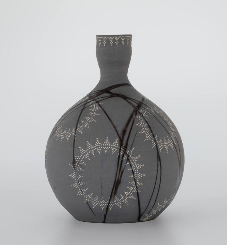 Gray vase with dot patterns and dark lines