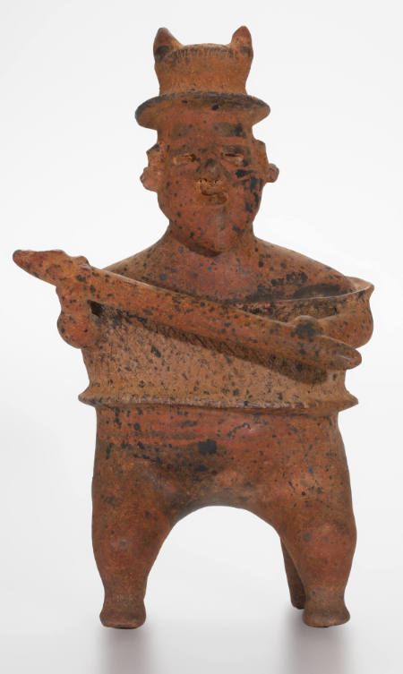 Seated male warrior figure with club
