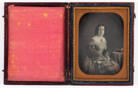 [Woman with bottle curls wearing a shawl]