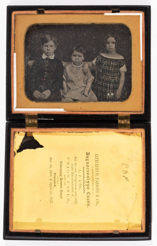 Untitled [Three children, seated]