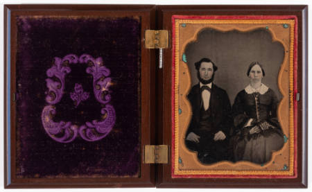 Untitled [Couple, cheeks enhanced in red, jewelry painted gold]