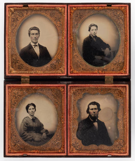 Untitled [Seated young boy, hands in lap, cheeks enhanced in red; older cleanshaven man, cheeks enhanced in red; man with full beard, cheeks enhanced in red; seated woman in checked dress, lips and cheeks enhanced in red]