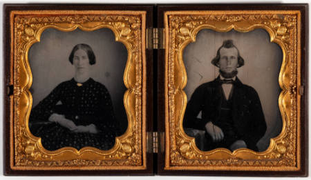 Untitled [(Left image) Young woman, hands clasped in lap, cheeks enhanced in red, jewelry painted gold; (Right image) Young bearded man, right arm resting on chair arm]