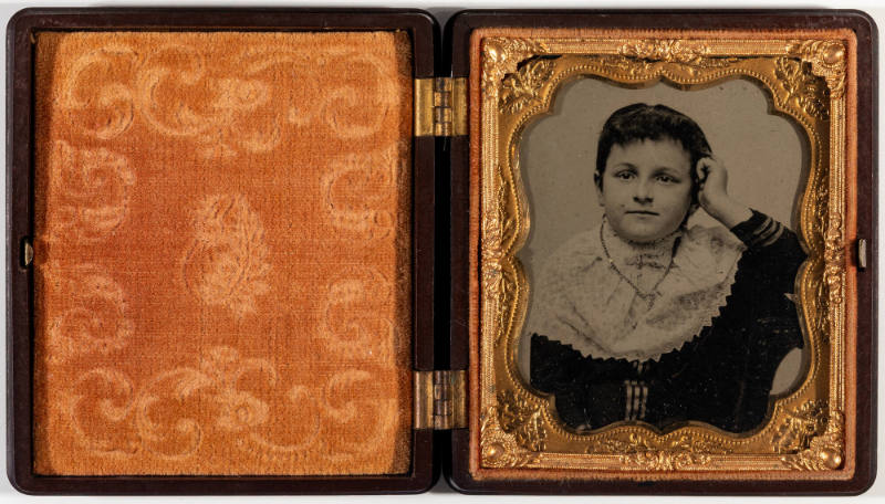 Untitled [Young, short-haired woman with large lace ruff, left hand on cheek]