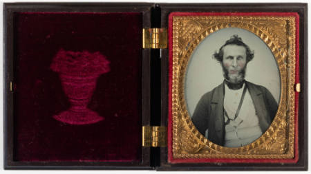 Untitled [Bearded middle-aged man, cheeks enhanced in red]