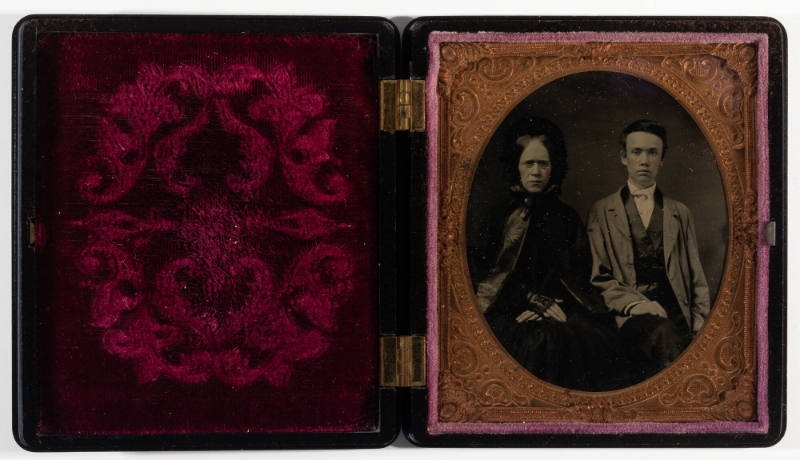 Untitled [Mother and teenage son, cheeks enhanced in red]