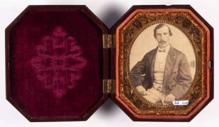 Untitled [Man with mustache, cheeks enhanced in red]