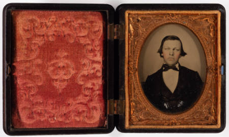 Untitled [Beardless young man, cheeks enhanced in red]