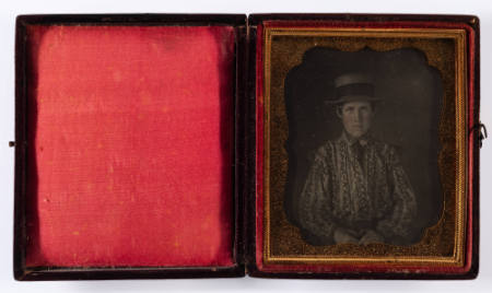 [Young man in a straw hat and floral shirt]
