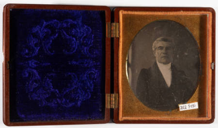 Untitled [Serious middle-aged man, cleanshaven]