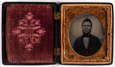 Untitled [Middle-aged bearded man, cheeks lightly enhanced in red]