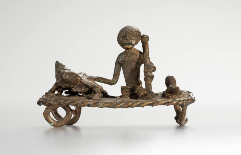 Figure of man with animals, goldweight (?)