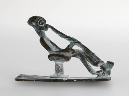 Goldweight in form of seated figure, smoking pipe, on stool