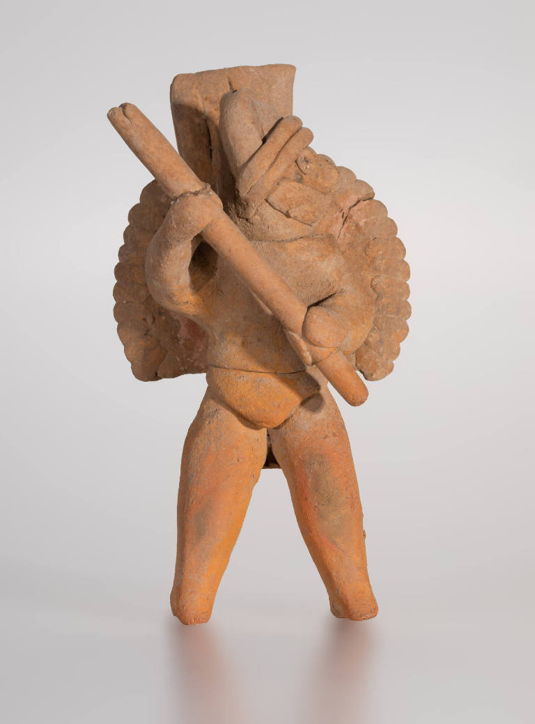 Warrior figure wielding a stick