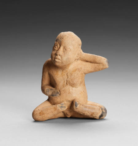 Figure of seated boy