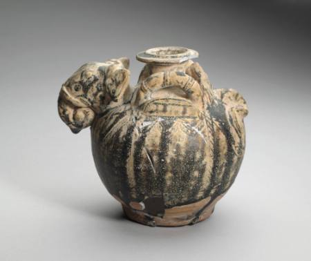 Globular small-necked jar with elephant's head and tail in relief on shoulders and with loop handles
