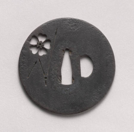 Pierced tsuba with design of cherry blossom and pine needle