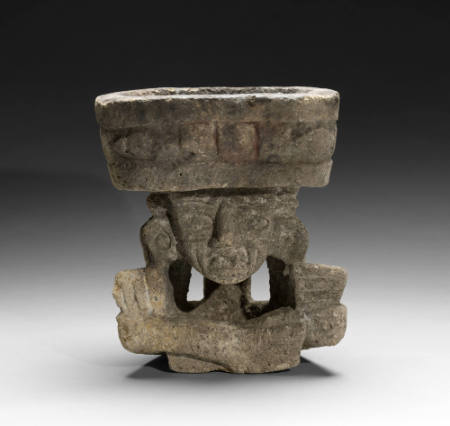 Carved volcanic tuff brazier