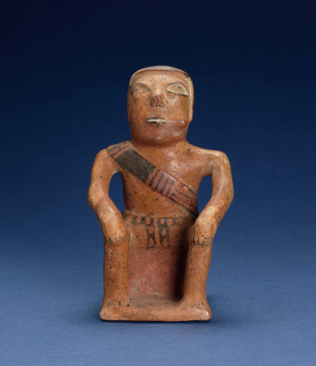 Seated Male "Coquero" Figure