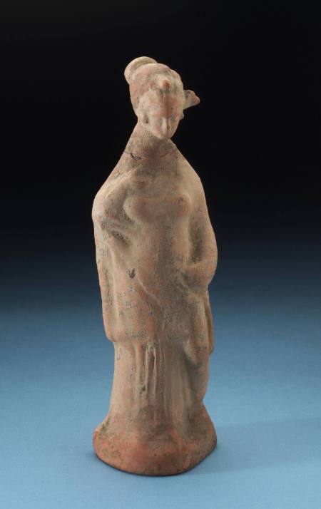 Standing female figure with left hand on hip,left leg bent